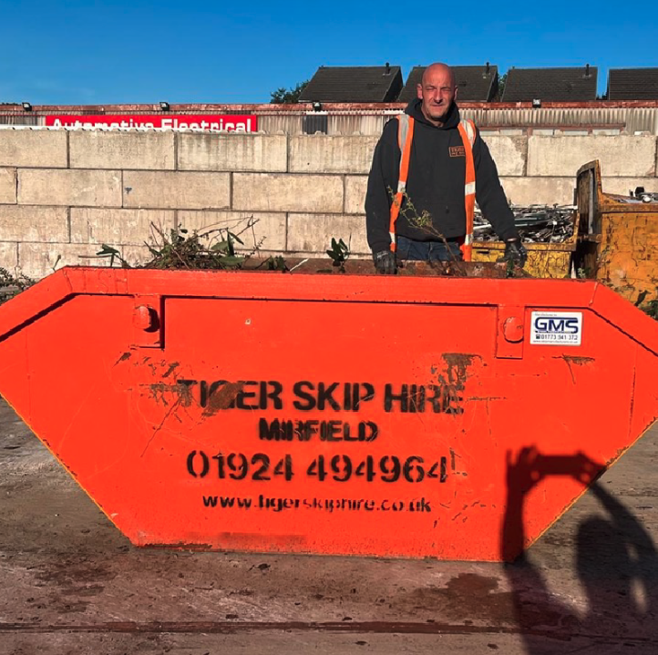 The Tiger Skip Hire team standing in front of their truck